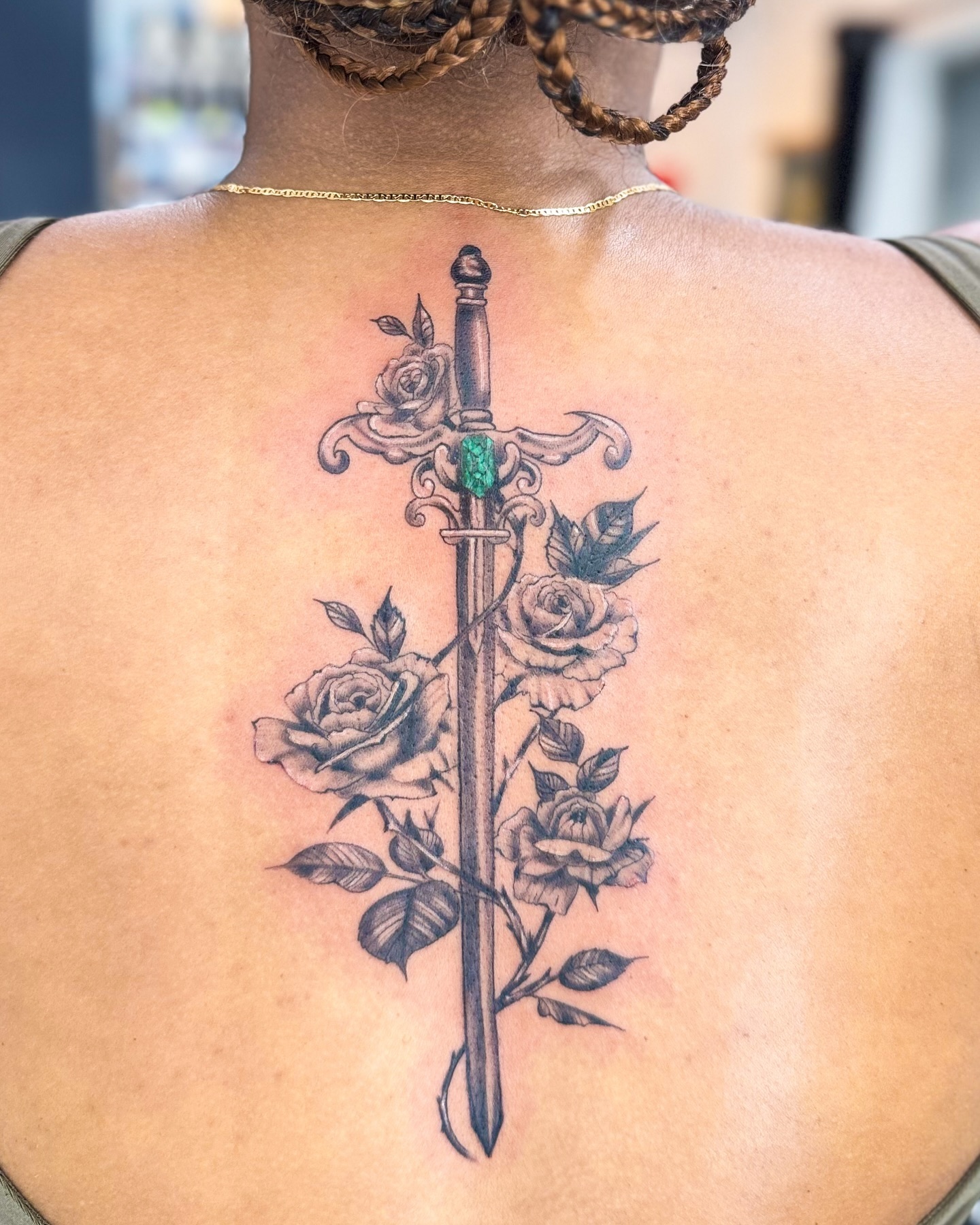 Sword and roses back tattoo