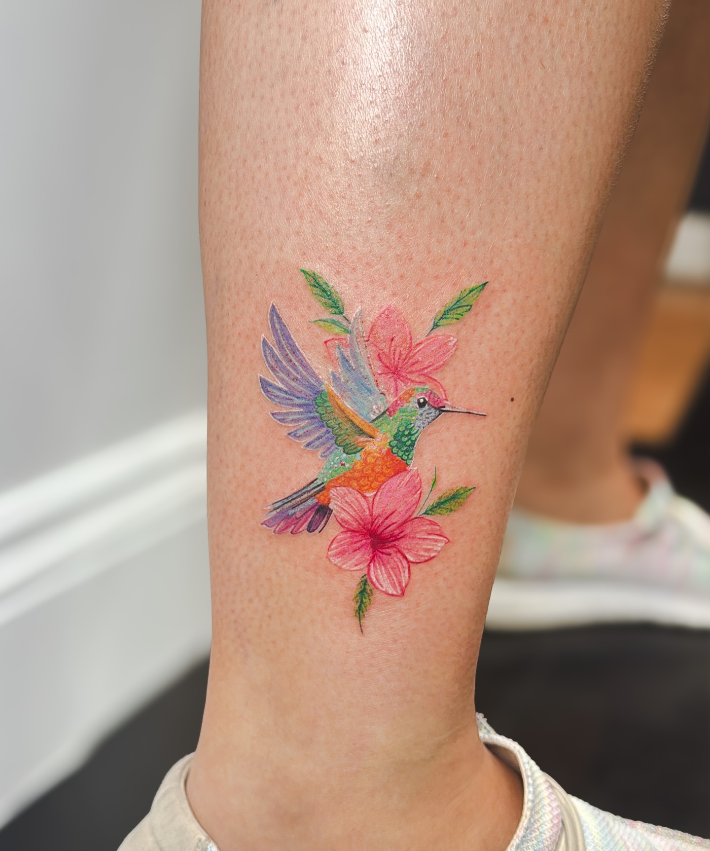 Colorful hummingbird tattoo